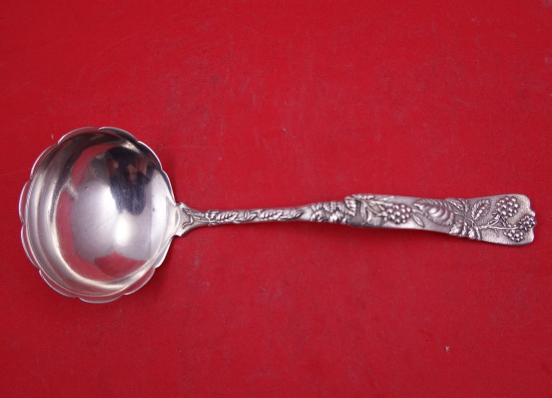 Tiffany and Co Vine Sterling Silver Gravy Ladle 7 Inch Raspberry Motif: Tiffany and Co Vine Sterling Silver Gravy Ladle 7 Inch Raspberry Motif A Tiffany & Co. Vine sterling silver gravy ladle in the scalloped Raspberry motif. The piece is monogrammed on the reverse, and t