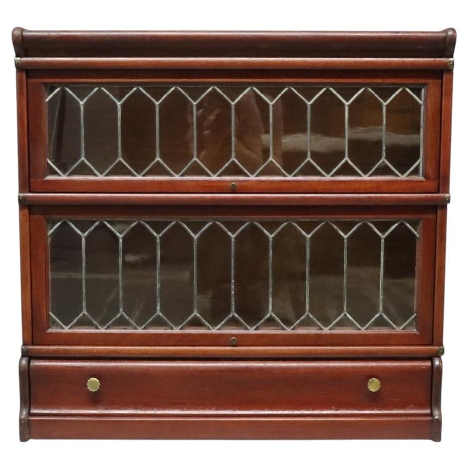 c1910 Mahogany Barrister Bookcase with Leaded Glass and Drawer: c1910 Mahogany Barrister Bookcase with Leaded Glass and Drawer An exceptional early 20th century Arts & Crafts barrister bookcase crafted from rich mahogany and dating to approximately 1910. This func