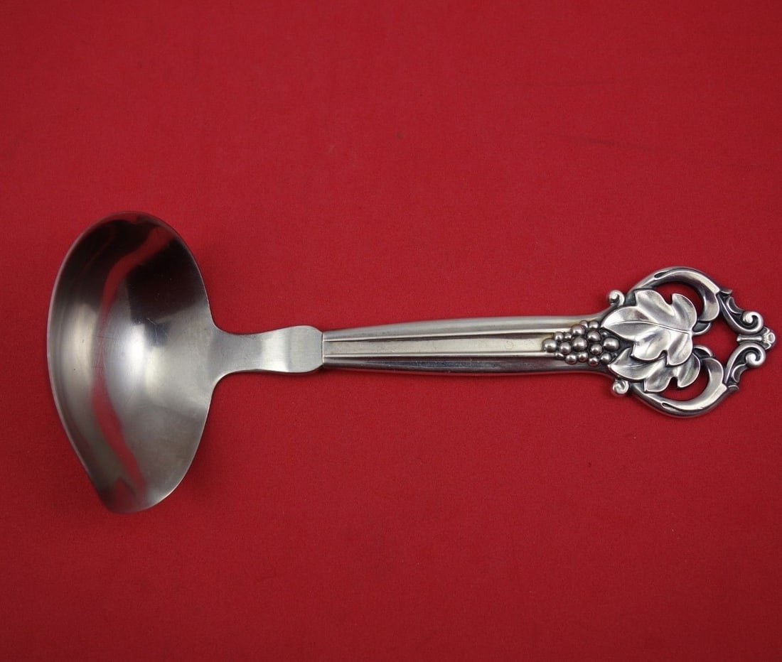 Cohr Sterling Silver Gravy Ladle 6 3/4 inch Grape Design: Cohr Sterling Silver Gravy Ladle 6 3/4 inch Grape Design This elegant gravy ladle from Cohr is crafted from high-quality sterling silver and features a hollow handle with a stainless implement. The de