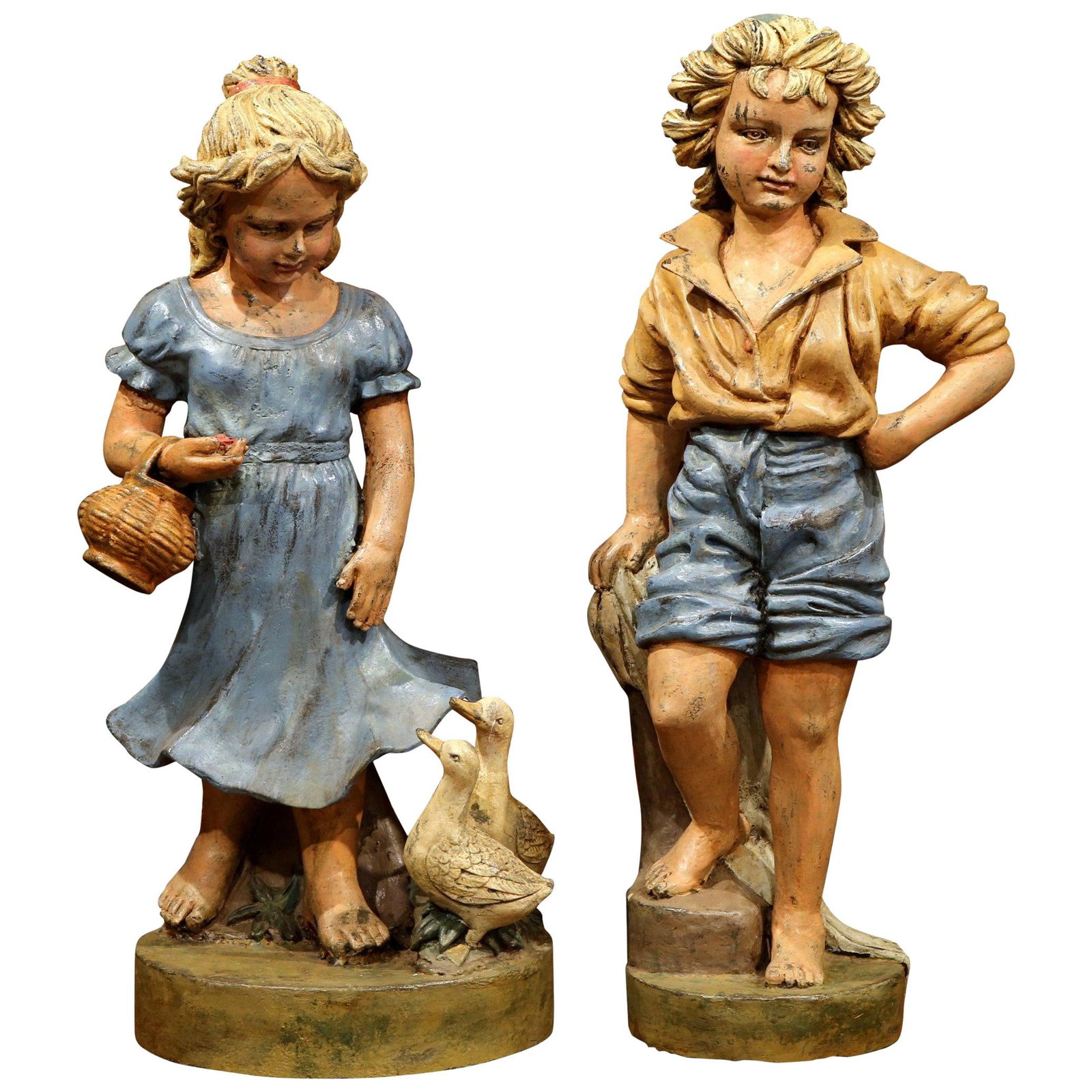Set of Two French Iron Painted Garden Child Figures Late 20th Century: Set of Two French Iron Painted Garden Child Figures Late 20th Century This pair of mid-century French garden statues features hand-crafted and hand-painted iron figures of a young boy and girl, each r