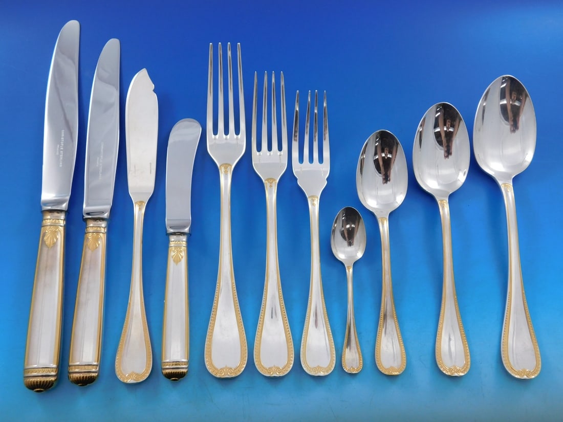 Christofle Malmaison Gold Sterling Silver 134 Piece Flatware Service: Christofle Malmaison Gold Sterling Silver 134 Piece Flatware Service This is a Christofle Malmaison Gold accent sterling silver flatware set in the Empire style, crafted in France. The set features cl
