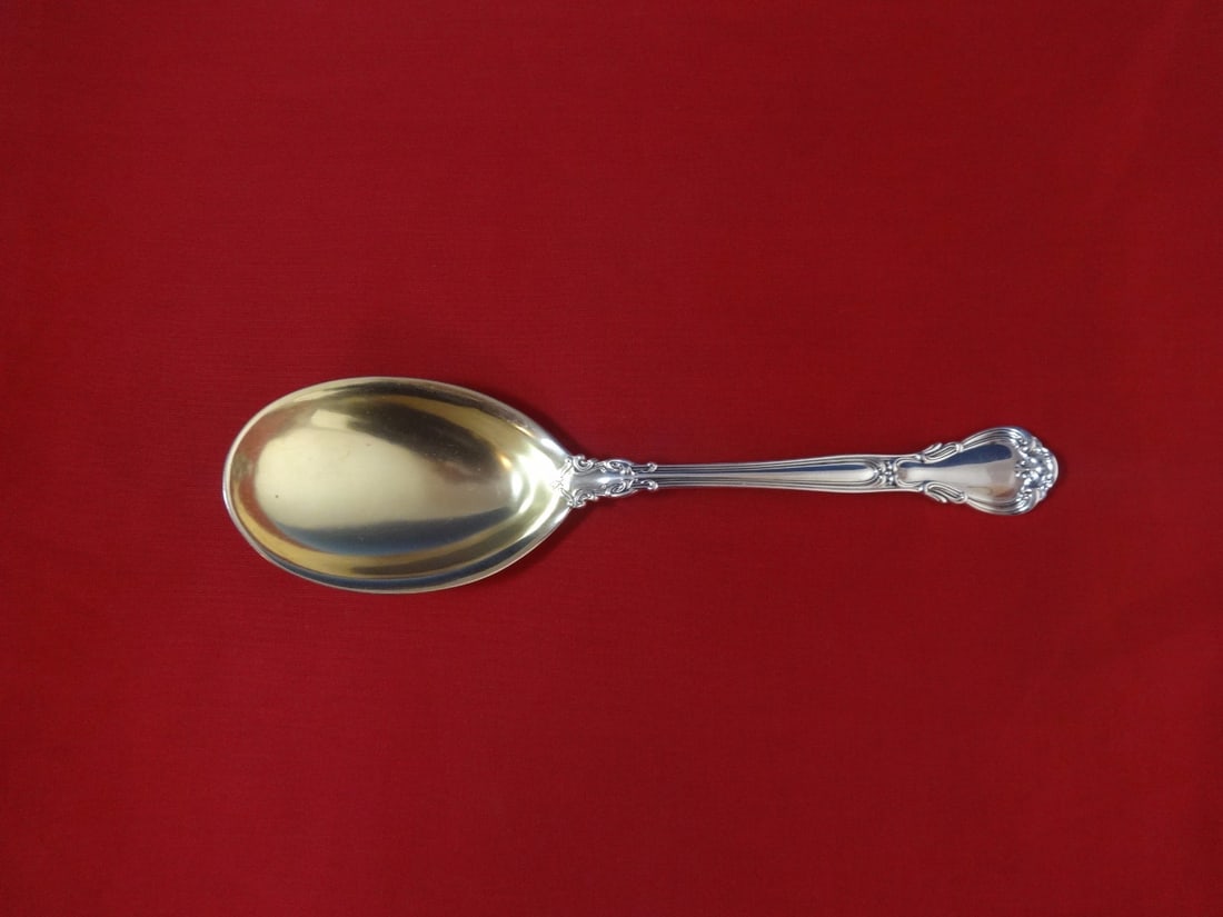 Birks Chantilly sterling silver berry spoon 9 inch gold washed: Birks Chantilly sterling silver berry spoon 9 inch gold washed This is a Birks Chantilly sterling silver berry spoon featuring a gold-washed teardrop-shaped bowl. The spoon is crafted in Canada and de