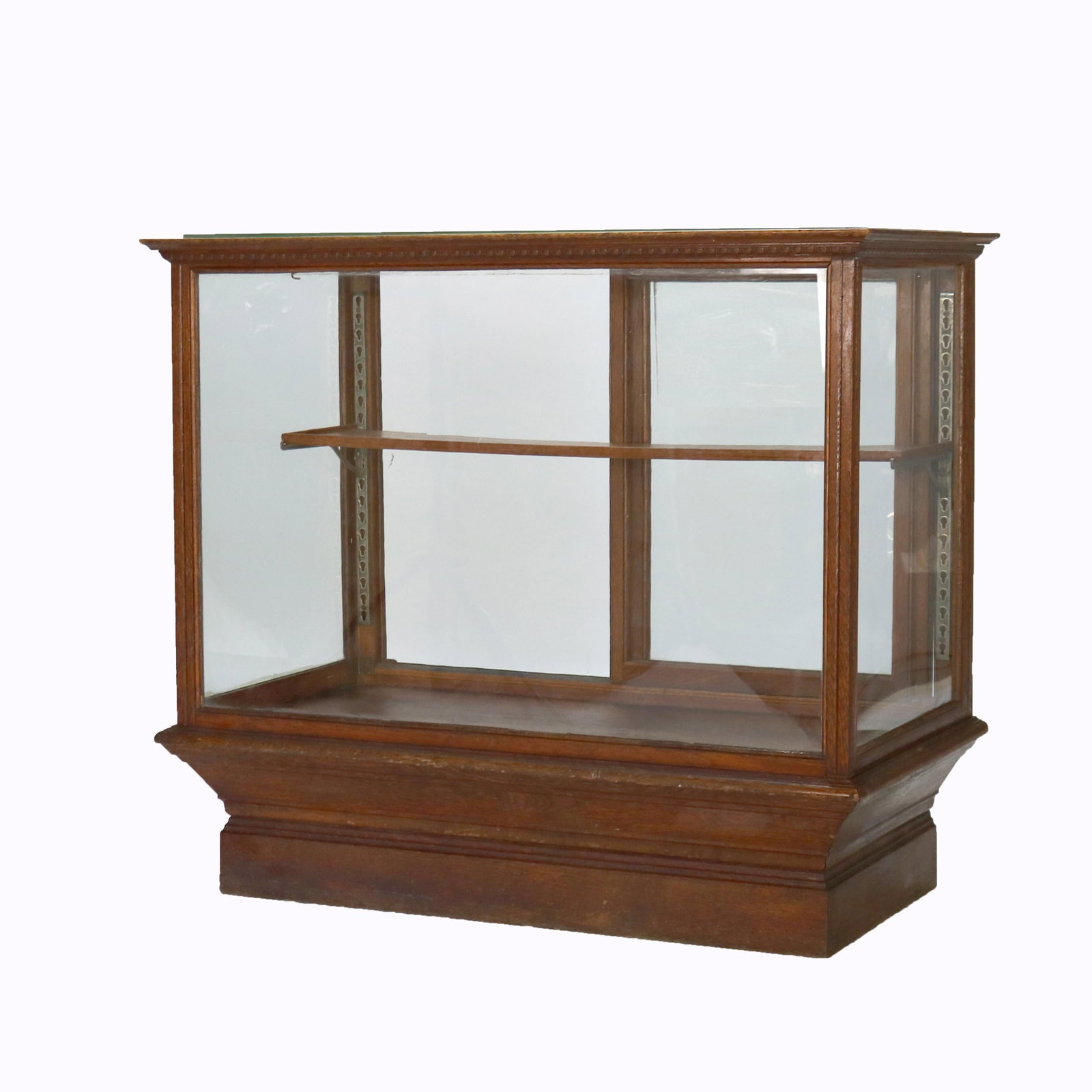 Early 20th Century Oak and Glass Floor Display Cabinet Circa 1910: Early 20th Century Oak and Glass Floor Display Cabinet Circa 1910 This antique oak and glass display cabinet, dating from circa 1910, was typically used in country stores. It features a sturdy oak fra