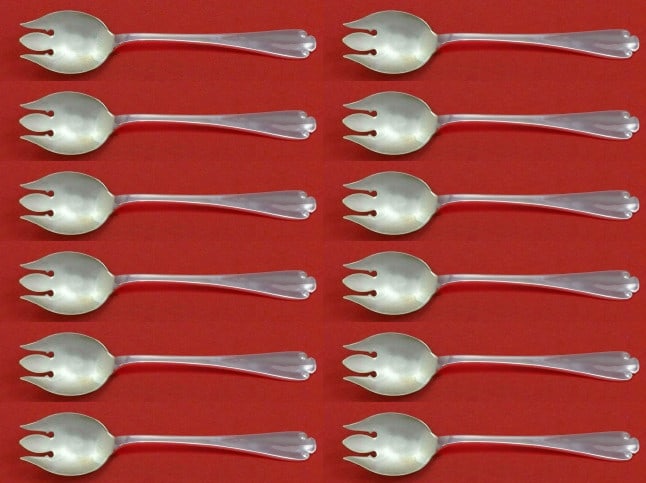 Tiffany & Co Flemish Sterling Silver Ice Cream Forks Set of 12: Tiffany & Co Flemish Sterling Silver Ice Cream Forks Set of 12 Indulge in a touch of elegance with this exquisite set of 12 ice cream forks from Tiffany & Co., crafted in the intricate Flemish pattern