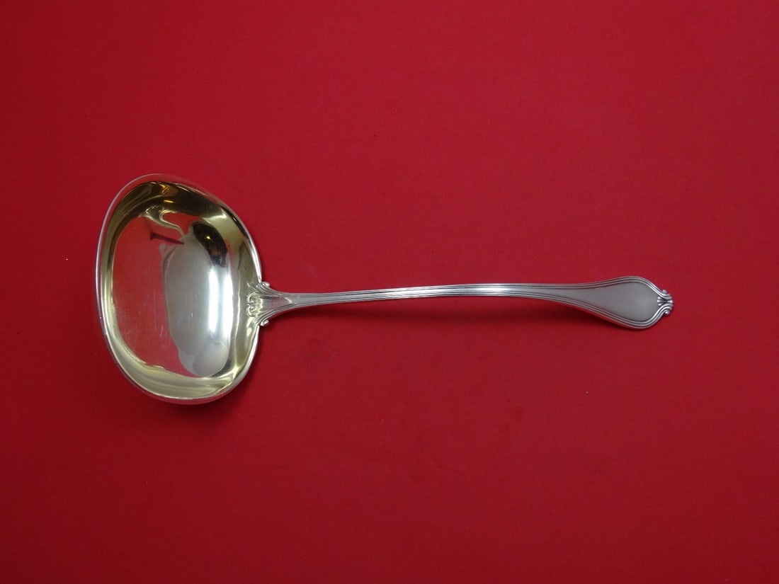 Towle Paul Revere Sterling Silver Gold Washed Oyster Ladle 10 1/4": Towle Paul Revere Sterling Silver Gold Washed Oyster Ladle 10 1/4" This exquisite Paul Revere oyster ladle by Towle is crafted from sterling silver and features a beautiful gold wash finish. Measuring