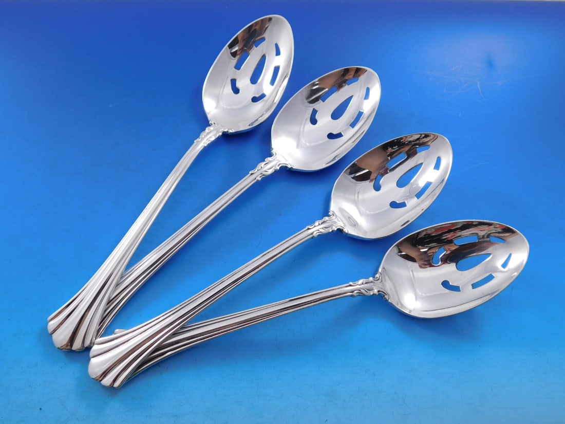 Set of 4 Reed Barton 18th Century Sterling Pierced Serving Spoons: Set of 4 Reed Barton 18th Century Sterling Pierced Serving Spoons A set of four Reed & Barton serving spoons in the 18th Century pattern, made of sterling silver. These original pierced serving spoons