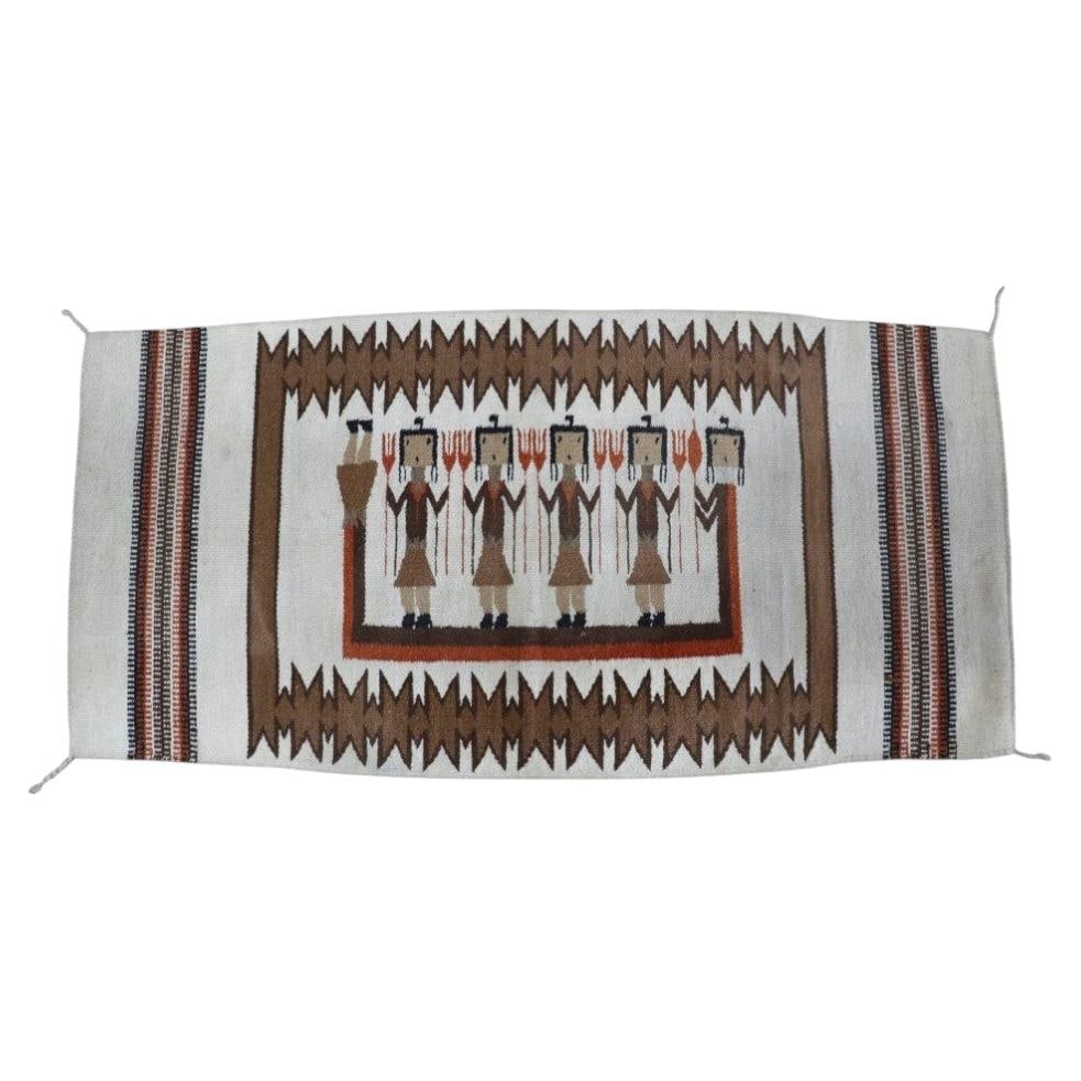 1930 Navajo Yei wool rug with five holy figures: 1930 Navajo Yei wool rug with five holy figures This antique Navajo Yei rug, dating to around 1930, is a hand-woven example of Southwest Native American textile art. Crafted from natural wool fibers, 