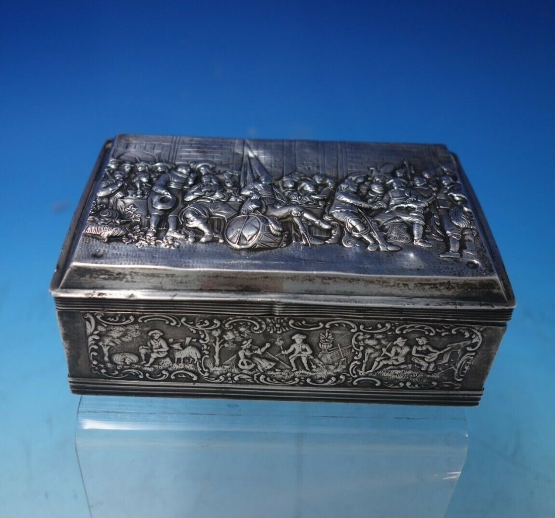 Netherlands 833 Silver Repousse Box with Street and Pastoral Motifs: Netherlands 833 Silver Repousse Box with Street and Pastoral Motifs This Dutch .833 silver box showcases intricate repoussed artistry, featuring a detailed street scene with people, buildings, and bir