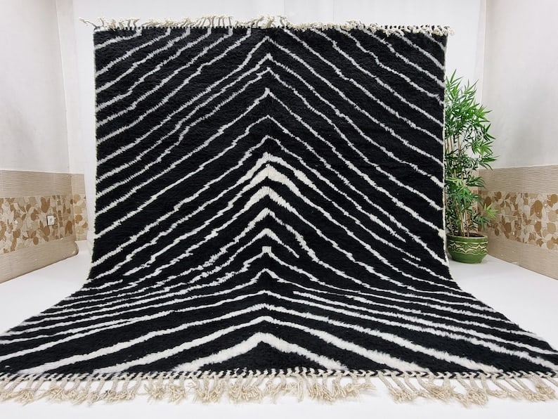 Authentic Handwoven Black and White Moroccan Rug 10 x 6.56 ft: Authentic Handwoven Black and White Moroccan Rug 10 x 6.56 ft This stunning soft black and white rug is an authentic piece handwoven in the Atlas Mountains by skilled local Berber women weavers. Craft