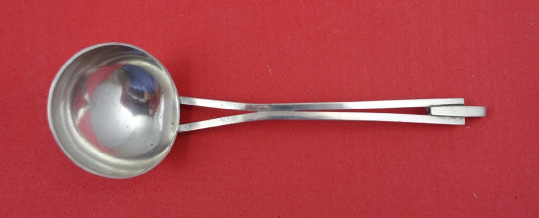 Georg Jensen Arts and Crafts Sterling Silver Sauce Ladle 5 1/8": Georg Jensen Arts and Crafts Sterling Silver Sauce Ladle 5 1/8" This exquisite Arts and Crafts style sterling silver sauce ladle is handwrought and retailed by Georg Jensen. Measuring 5 1/8 inches, th
