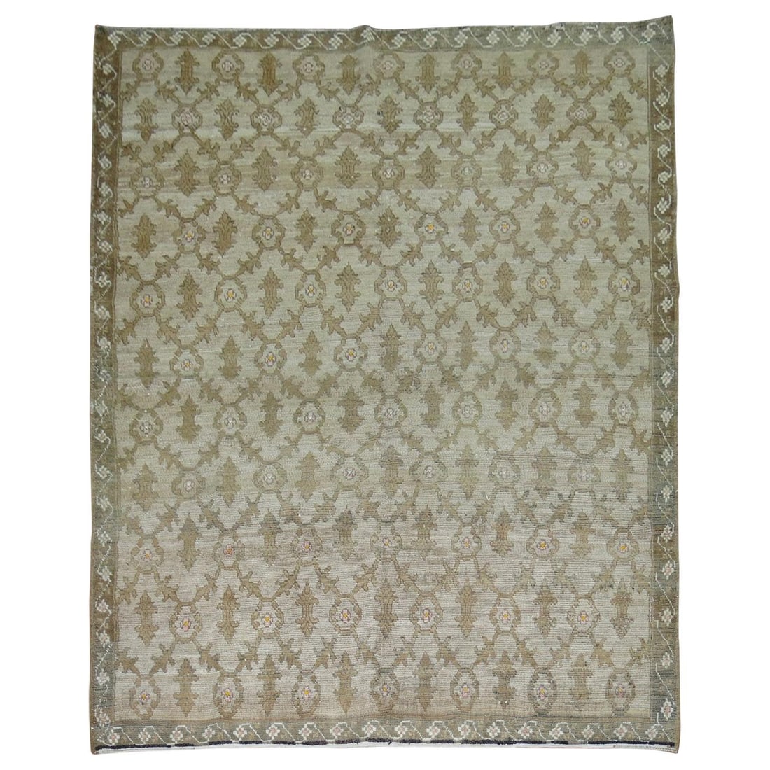Wool Hand Woven Turkish Konya Rug 83 x 108 in: Wool Hand Woven Turkish Konya Rug 83 x 108 in This one-of-a-kind vintage Turkish Konya rug features an all-over design in brown and gray accents, framed by a narrow border. Hand-woven from wool, it ex
