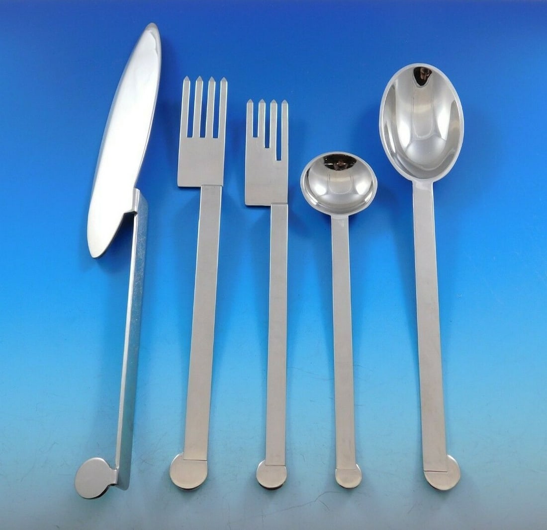65 Piece XUM Mid Century Modern Stainless Flatware by Bissell Wilhite: 65 Piece XUM Mid Century Modern Stainless Flatware by Bissell Wilhite This extremely rare "XUM" flatware set by Bissell & Wilhite features a striking mid-century modern design with geometric handles a