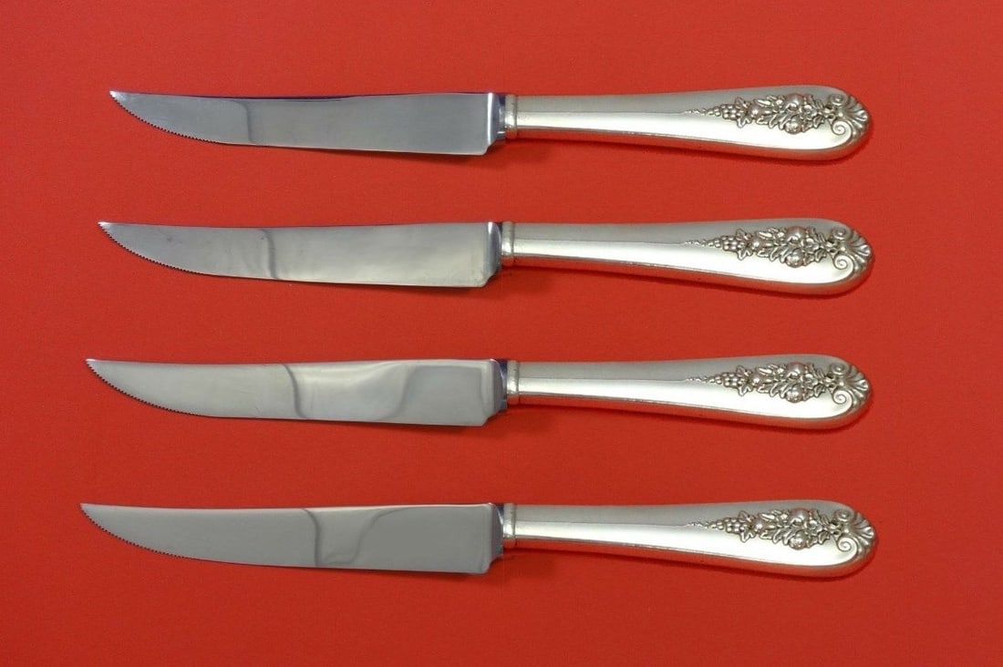 Lunt Pendant-Of-Fruit Sterling Silver Steak Knife Set 4pc Custom 8.5": Lunt Pendant-Of-Fruit Sterling Silver Steak Knife Set 4pc Custom 8.5" Elevate your dining experience with this exquisite 4-piece steak knife set in the Pendant-Of-Fruit pattern by Lunt. Crafted from p