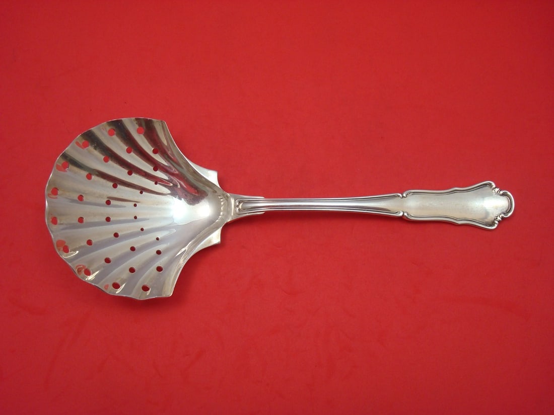 Buccellati Savoy Sterling Silver Berry Ice Spoon 8 3/4" Pierced Shell: Buccellati Savoy Sterling Silver Berry Ice Spoon 8 3/4" Pierced Shell Enhance your dining experience with this exquisite Savoy pattern serving spoon by Buccellati. Crafted from high-quality sterling s