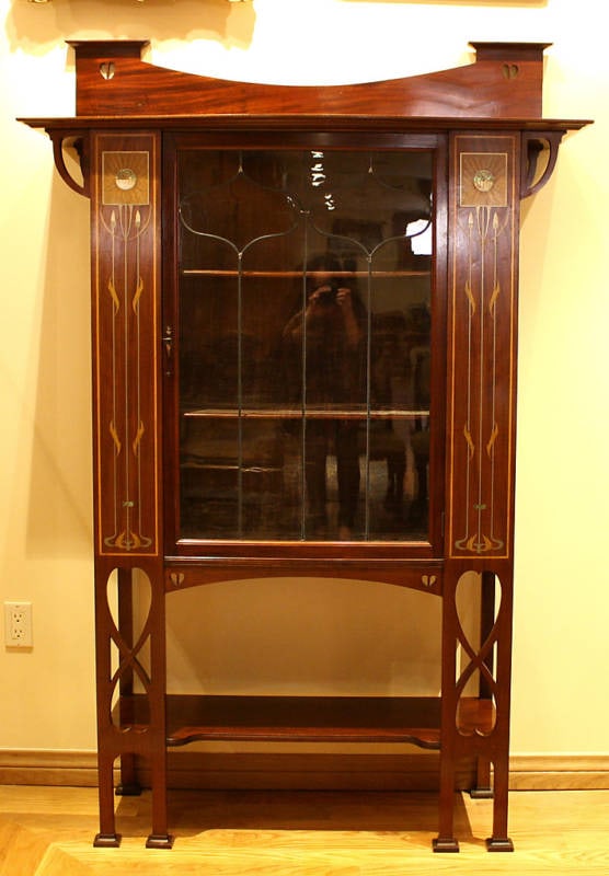 Rare 1900 Art Nouveau Inlaid Mother of Pearl Cabinet by Wylie & Lockhead: Rare 1900 Art Nouveau Inlaid Mother of Pearl Cabinet by Wylie & Lockhead This exquisite Art Nouveau cabinet, dating back to circa 1900, showcases the craftsmanship of Wylie & Lockhead. It features a s