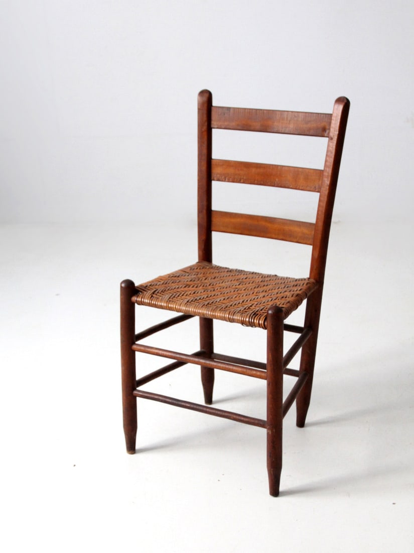 Rustic Antique Splint Weave Chair with Ladder Back: Rustic Antique Splint Weave Chair with Ladder Back This antique splint weave seat chair is a charming addition to any home decor. Crafted from rustic natural wood, it features a classic ladder back de