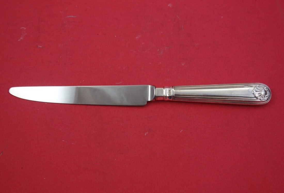 Terry Shaver Sterling Silver Dinner Knife Fiddle Thread Shell 10": Terry Shaver Sterling Silver Dinner Knife Fiddle Thread Shell 10" This exquisite dinner knife features the elegant Fiddle Thread and Shell pattern, crafted from high-quality sterling silver. Made by T