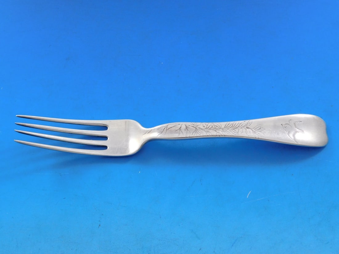 Tiffany & Co Lap Over Edge Sterling Silver Fork 7 1/4" Bird Branch: Tiffany & Co Lap Over Edge Sterling Silver Fork 7 1/4" Bird Branch This exquisite fork from Tiffany & Co. features the elegant Lap Over Edge pattern, showcasing a beautiful acid-etched design with a b