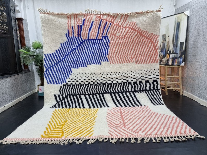 Authentic Handmade Moroccan Berber Wool Area Rug 9.84 x 6.56 Feet: Authentic Handmade Moroccan Berber Wool Area Rug 9.84 x 6.56 Feet Experience the charm of the Atlas Mountains with this Authentic Artistic Soft Colorful Handmade Moroccan Berber Wool Area Rug. This ex