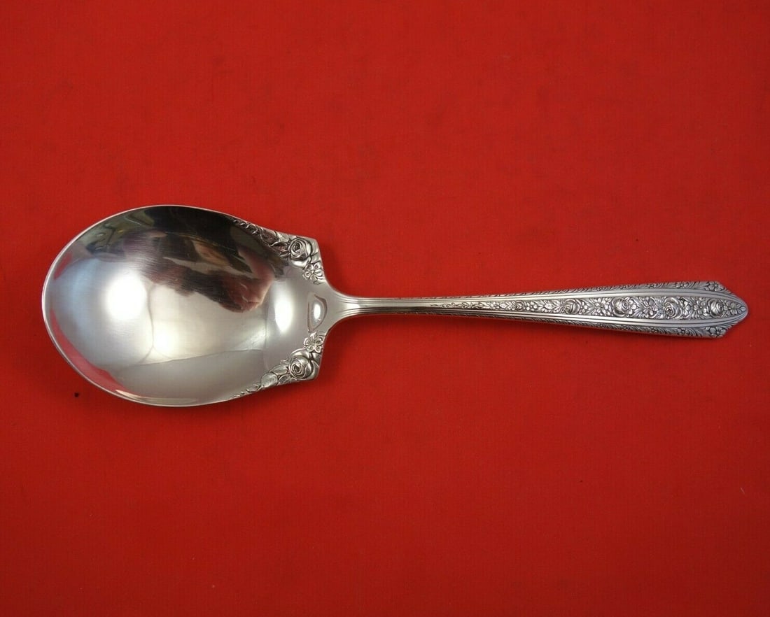Wallace Normandie Sterling Silver Serving Spoon 9 1/8": Wallace Normandie Sterling Silver Serving Spoon 9 1/8" Discover the exquisite Normandie Berry Spoon by Wallace, crafted from high-quality sterling silver. This elegant serving spoon measures 9 1/8" an