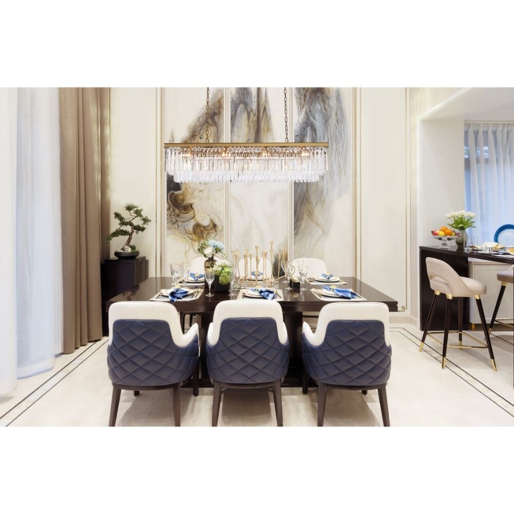 Satin Gold Crystal 12-Light Sydney Chandelier 60 Inch: Satin Gold Crystal 12-Light Sydney Chandelier 60 Inch This modern crystal chandelier features a satin gold frame and a rectangular design, making it a striking addition to dining rooms, kitchens, foye