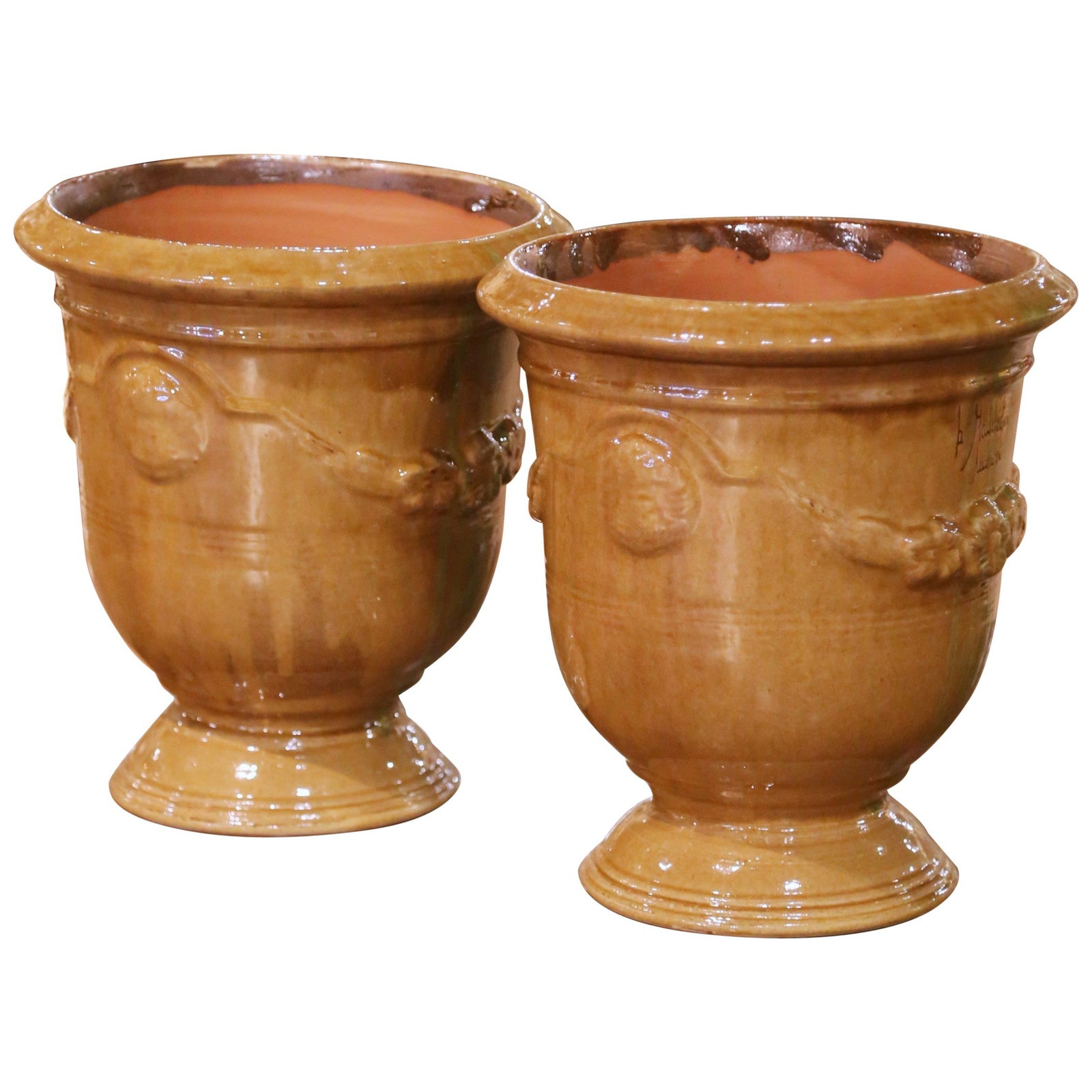 Set of Two Ochre Glazed French Anduze Terracotta Planters Signed La Madeleine: Set of Two Ochre Glazed French Anduze Terracotta Planters Signed La Madeleine This pair of handmade French Anduze planters, signed La Madeleine a Anduze, brings timeless Provencal character to any gar