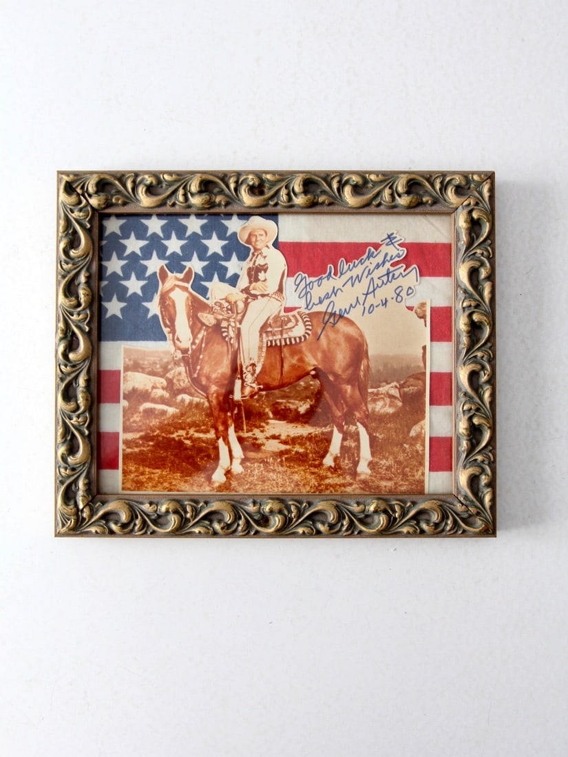 Gene Autry Vintage Signed Photograph Framed Western Art: Gene Autry Vintage Signed Photograph Framed Western Art This vintage photograph features Gene Autry, the iconic American cowboy and singer, captured in a charming moment on his horse. The photograph i