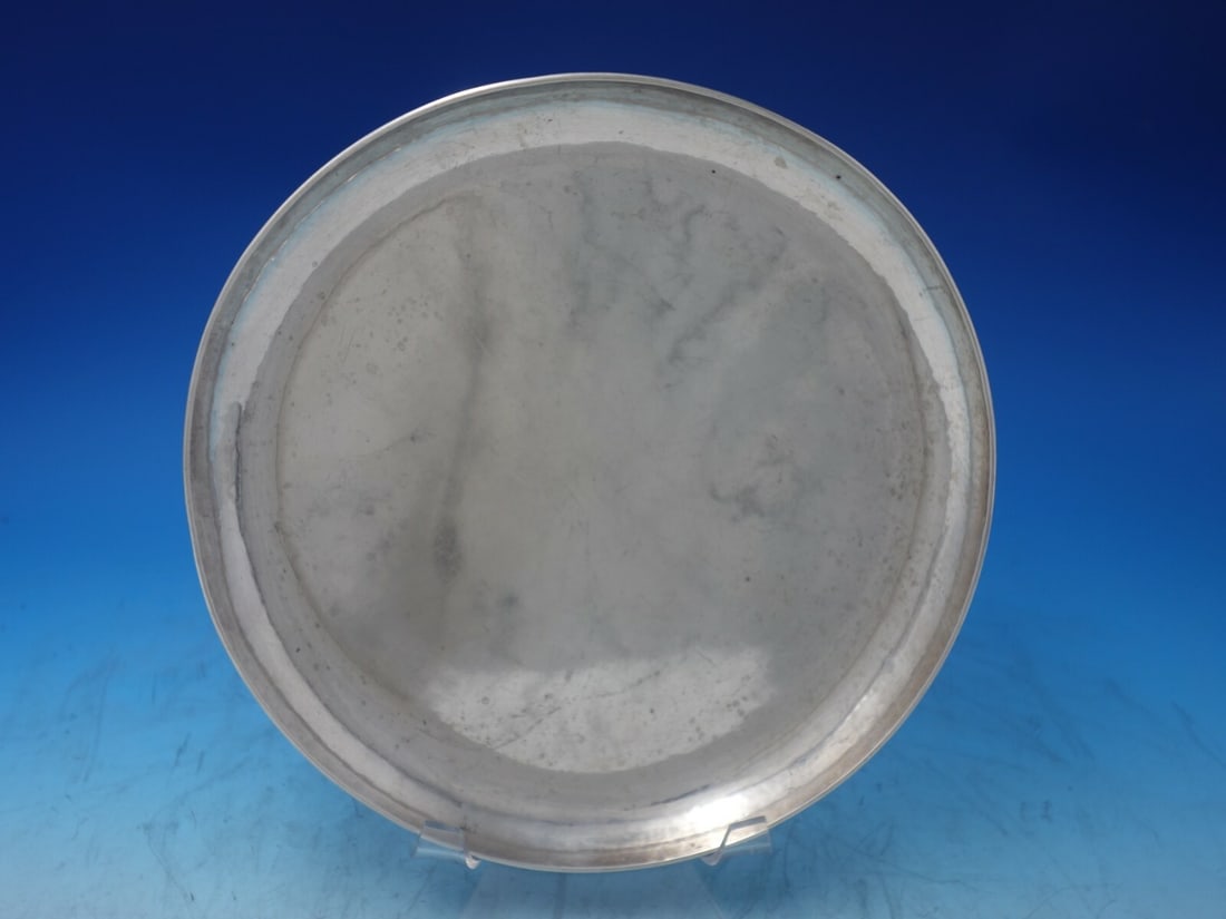 Kalo Sterling Silver Handwrought Plate 10" Diameter 15.6 Troy Ounces: Kalo Sterling Silver Handwrought Plate 10" Diameter 15.6 Troy Ounces This exquisite Kalo sterling silver plate showcases the craftsmanship of Kalo, a renowned maker in silverware. Handwrought and feat