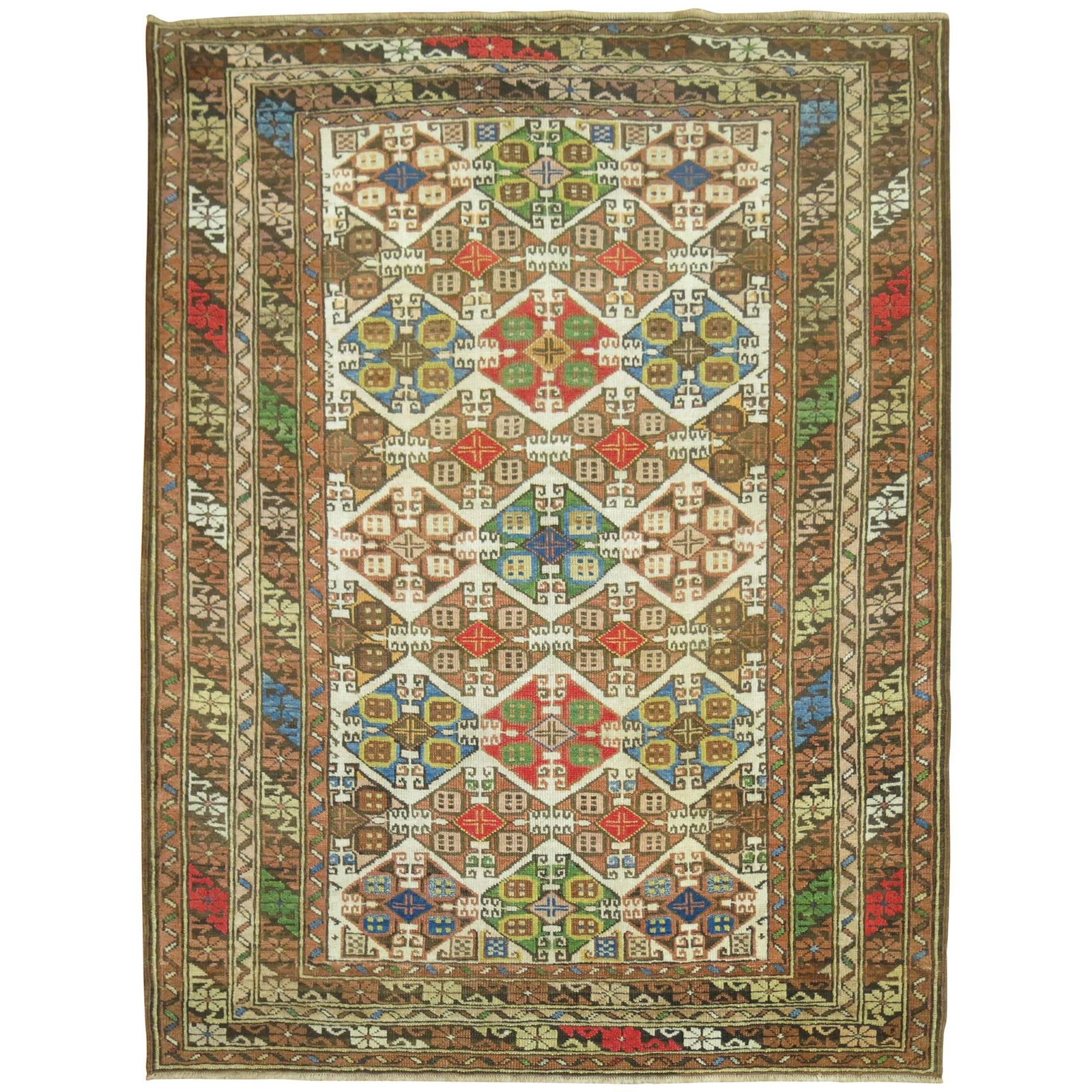 Early 20th Century Wool Kazak Caucasus Rug 42 x 56 in: Early 20th Century Wool Kazak Caucasus Rug 42 x 56 in This antique Caucasian rug, crafted in the early 20th century, features a vibrant color palette and classic Kazak style. Made from wool, it showca