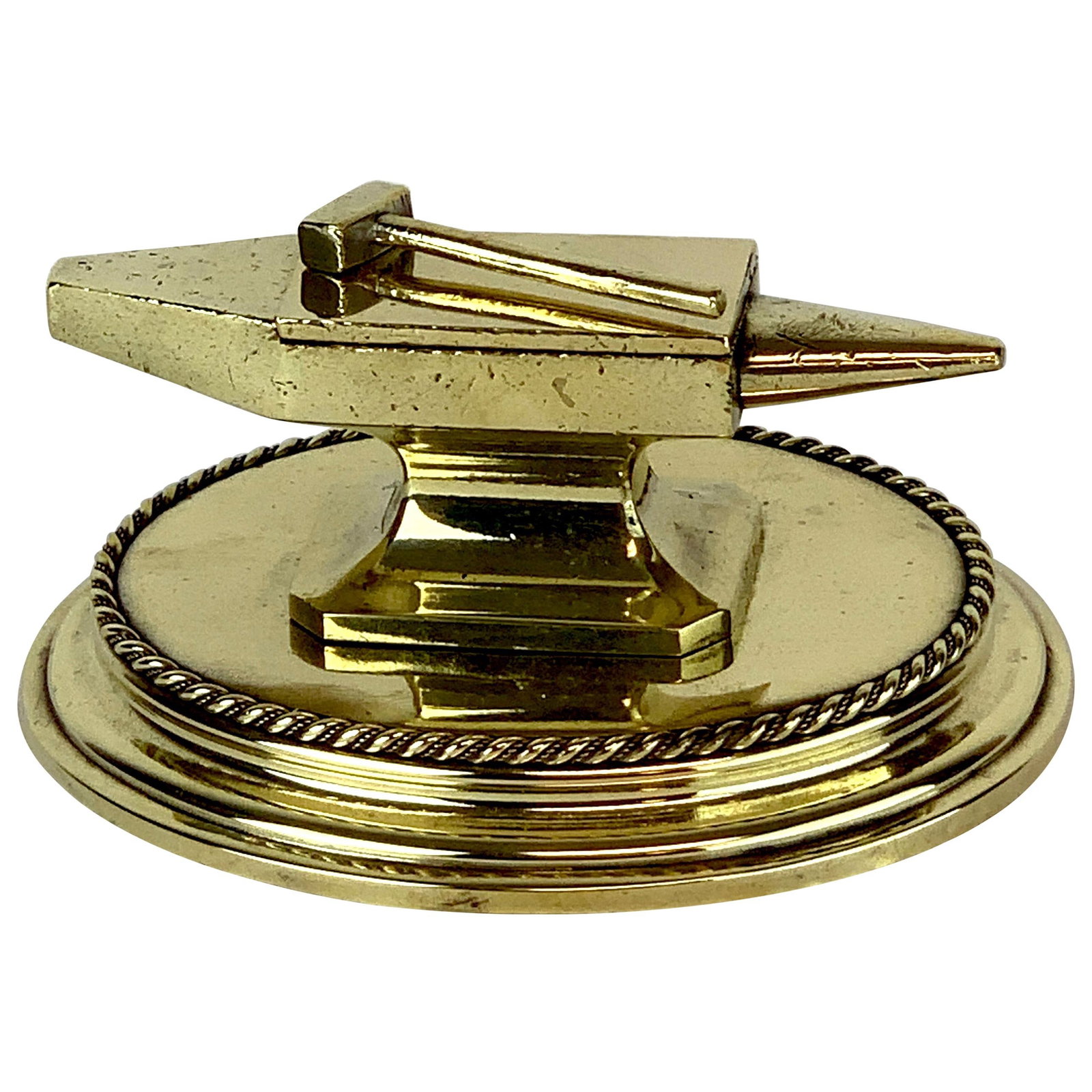 19th Century High Victorian Brass Anvil Matchstrike from England: 19th Century High Victorian Brass Anvil Matchstrike from England This Antique English Brass Anvil Matchstrike is a striking piece from the 19th century, specifically crafted in the 1870s. It features 