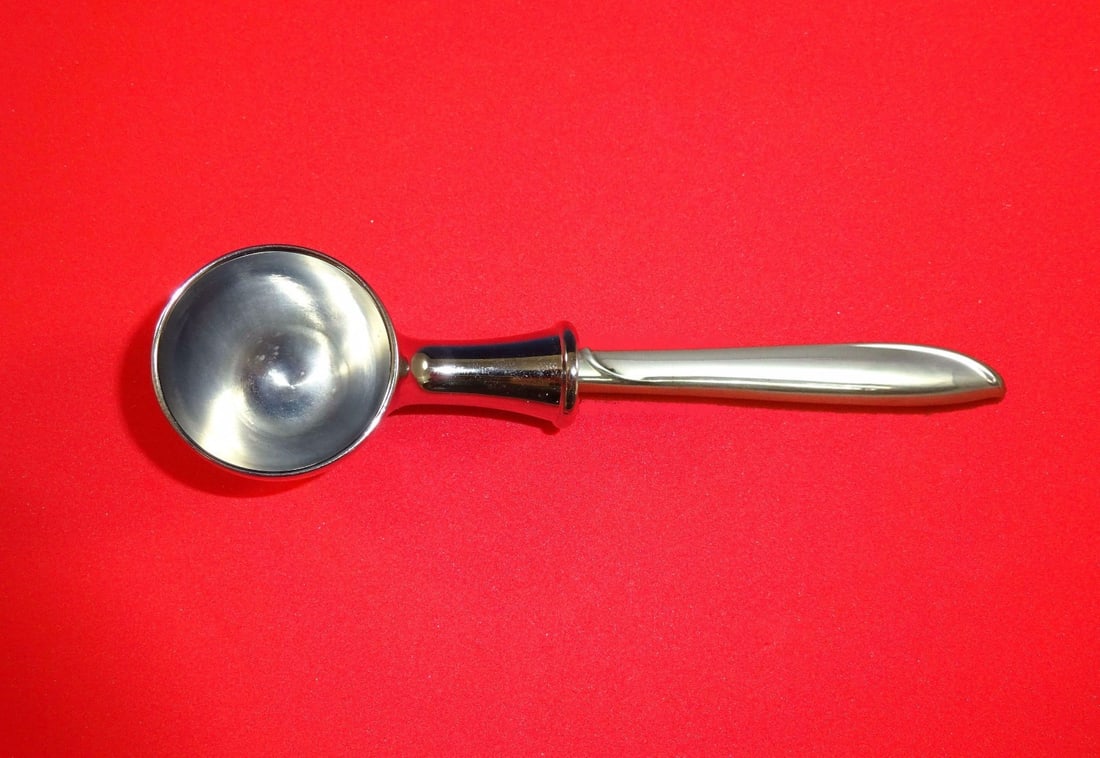 Custom Silver Rhythm Coffee Scoop by International Sterling 6": Custom Silver Rhythm Coffee Scoop by International Sterling 6" This custom-made coffee scoop is crafted from sterling silver with a chrome-plated implement, showcasing the elegant Silver Rhythm patter