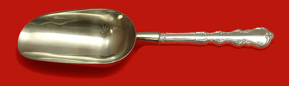 International Sterling Silver Ice Scoop Angelique Pattern 9 3/4 Custom Made: International Sterling Silver Ice Scoop Angelique Pattern 9 3/4 Custom Made Elevate your serving experience with the Angelique Ice Scoop by International Sterling. This custom-made piece, measuring 9 
