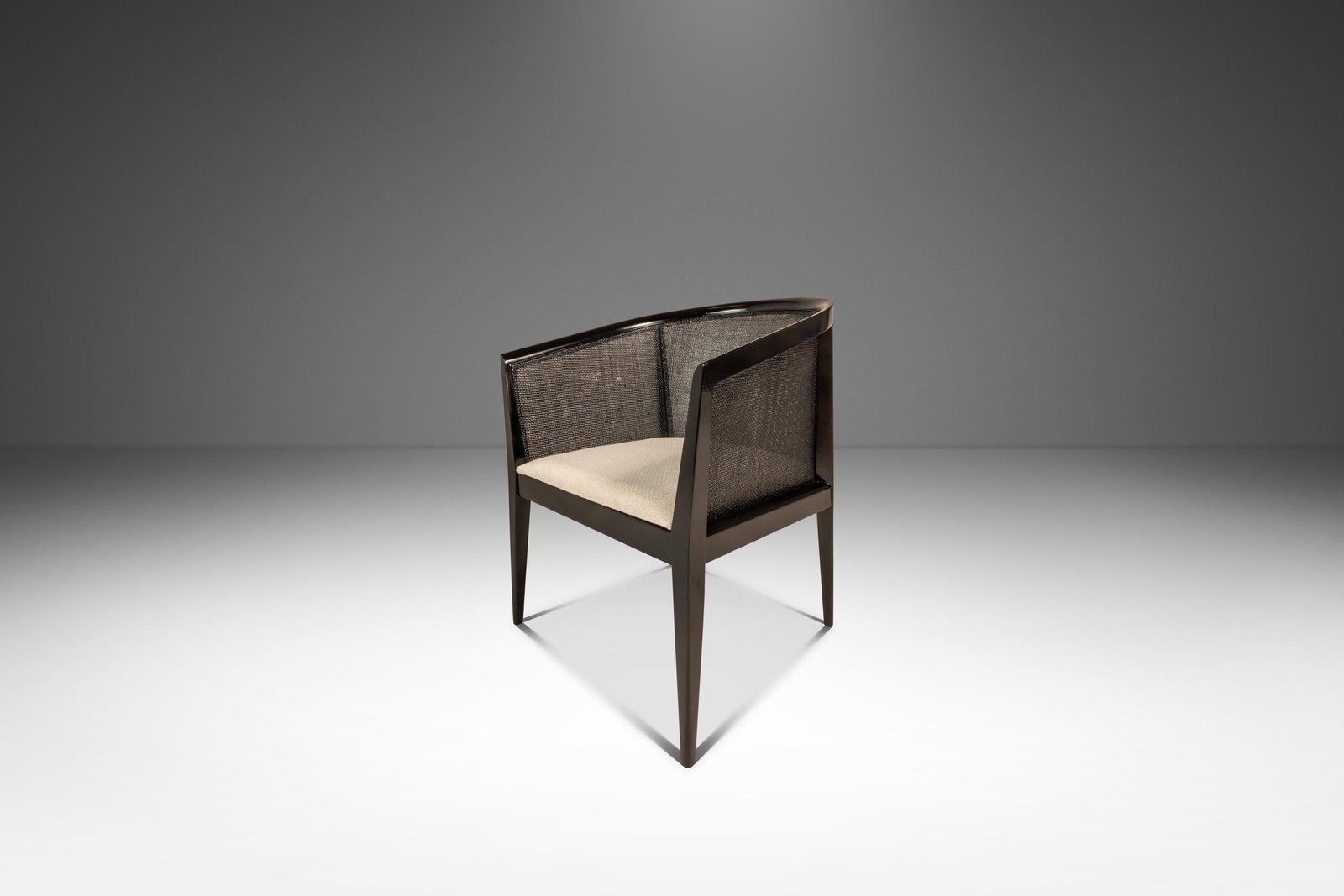 Kipp Stewart Mid-Century Ebonized Caned-Back Lounge Chair for Directional 1950s: Kipp Stewart Mid-Century Ebonized Caned-Back Lounge Chair for Directional 1950s This exquisite Mid-Century Modern lounge chair, designed by Kipp Stewart for Directional in the 1950s, showcases a perfe