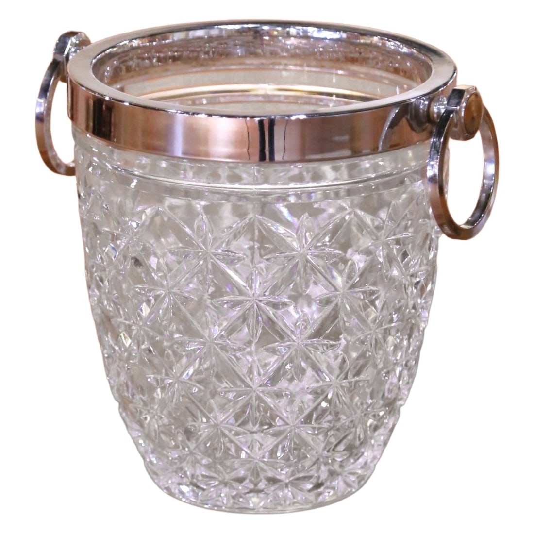 French Cut Crystal Ice Bucket with Silvered Ring Handle Accents circa 1960: French Cut Crystal Ice Bucket with Silvered Ring Handle Accents circa 1960 This mid-century French ice bucket, crafted circa 1960, features hand-cut crystal with a deeply etched starburst and diamond 