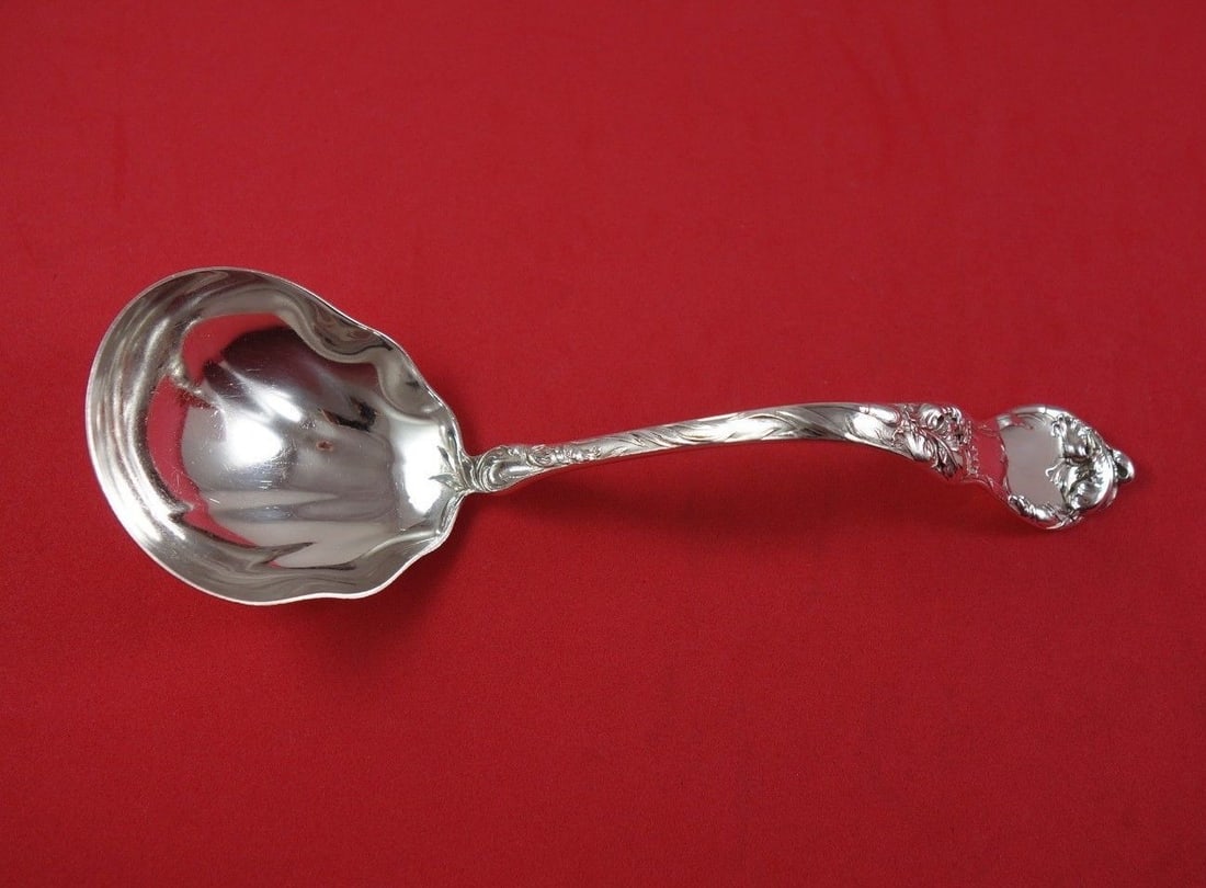 Reed and Barton Les Cinq Fleurs Sterling Silver Gravy Ladle 7 3/8": Reed and Barton Les Cinq Fleurs Sterling Silver Gravy Ladle 7 3/8" This exquisite ladle from Reed and Barton features the elegant Les Cinq Fleurs pattern, showcasing a beautifully curved handle. Craft