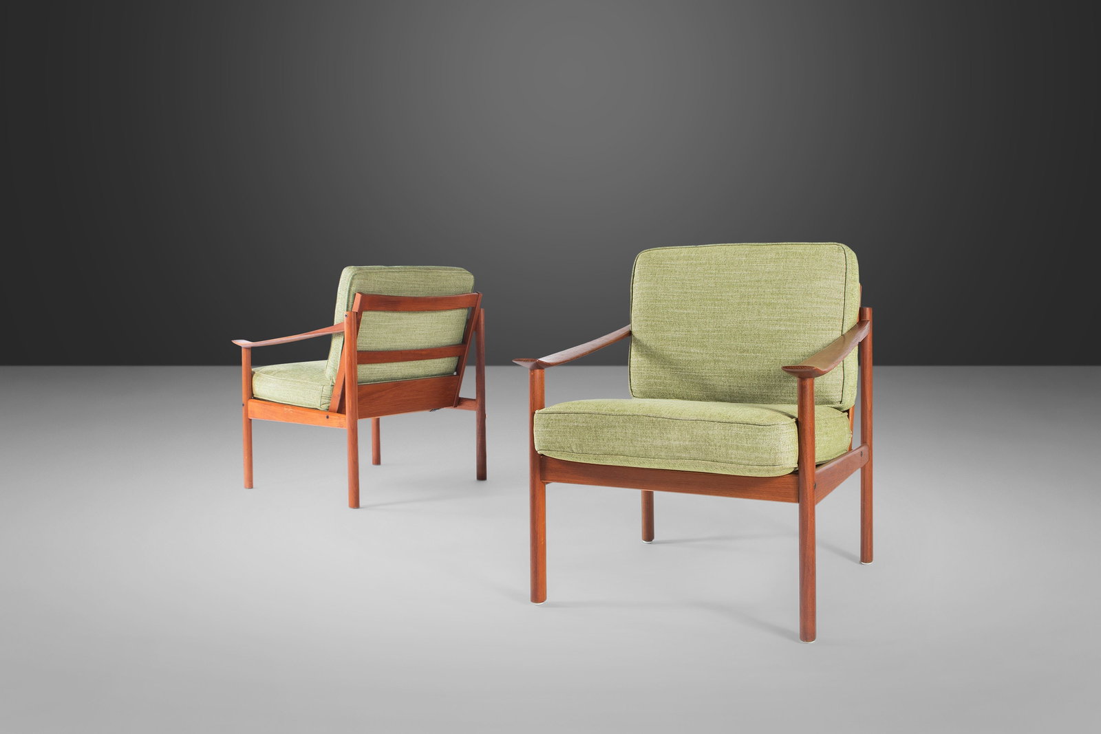 Rare Set of Two Peter Hvidt Lounge Chairs in Teak 1960s Denmark: Rare Set of Two Peter Hvidt Lounge Chairs in Teak 1960s Denmark This exquisite set of two Danish Mid Century Modern lounge chairs, designed by Peter Hvidt for Soborg Mobler, epitomizes functional art 