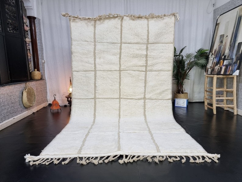 Authentic Moroccan Soft White Engraved Rug 100% Wool 10 x 5 Feet: Authentic Moroccan Soft White Engraved Rug 100% Wool 10 x 5 Feet Experience the elegance of this Authentic Soft White Engraved Rug, meticulously handwoven by skilled Berber women weavers in the Atlas 