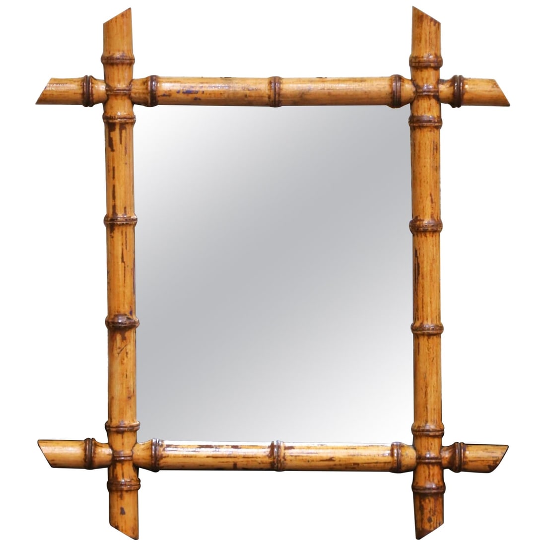 French Walnut Faux Bamboo Wall Mirror circa 1920: French Walnut Faux Bamboo Wall Mirror circa 1920 This early 20th-century French wall mirror features a hand-crafted walnut frame designed to resemble bamboo canes, reflecting the popular faux bamboo m