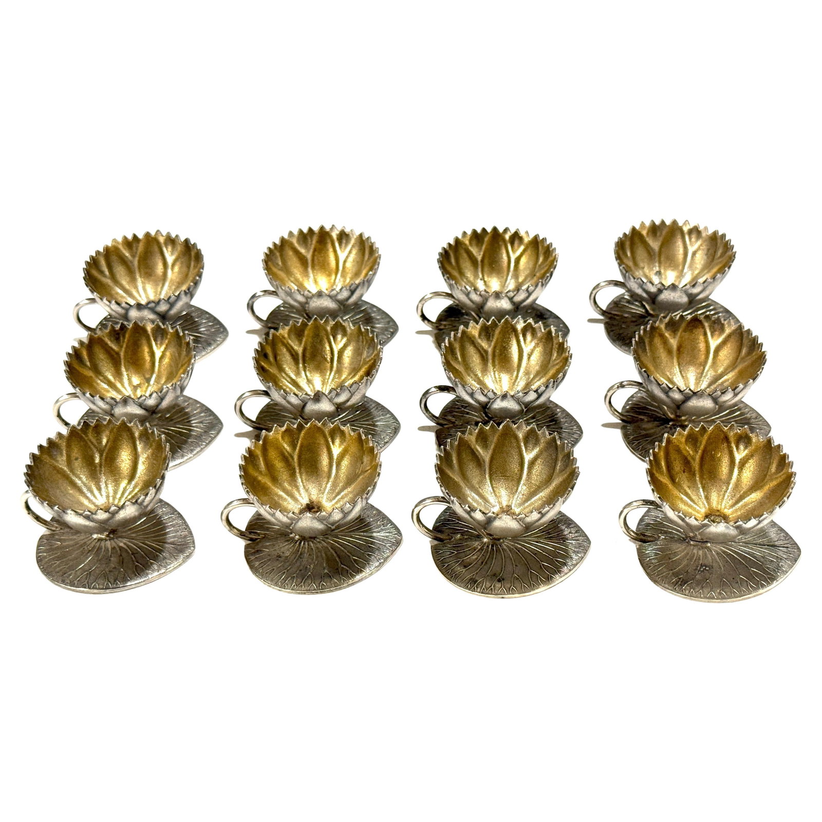 Set of 12 Meriden Aesthetic Movement Goldwashed Lotus Open Salts: Set of 12 Meriden Aesthetic Movement Goldwashed Lotus Open Salts This exquisite set of 12 open salts showcases the artistry of the American Aesthetic Movement, crafted by the Meriden Britannia Company