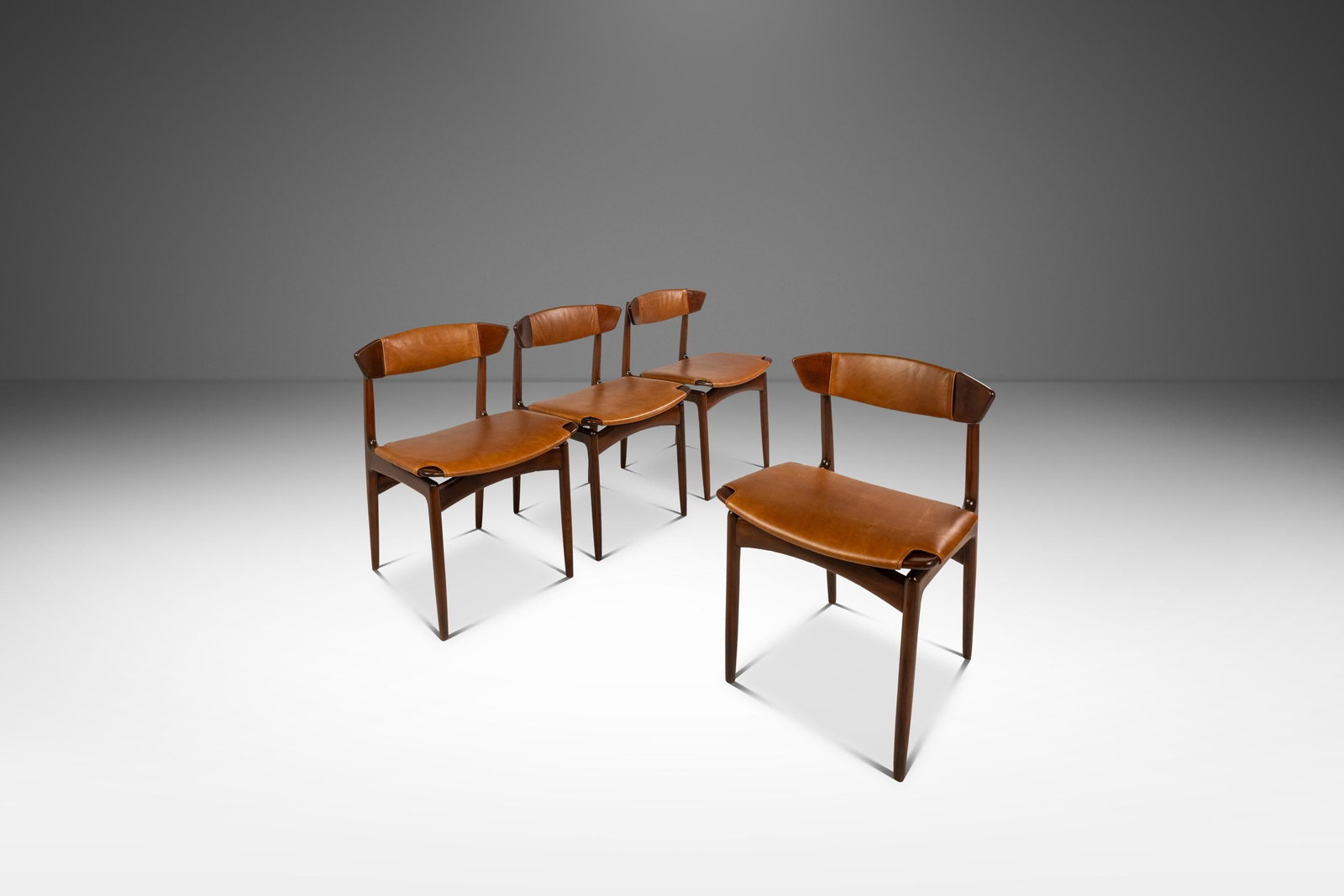 Rare Set of 4 Danish Modern Dining Chairs by Ib Kofod-Larsen in Beech Leather: Rare Set of 4 Danish Modern Dining Chairs by Ib Kofod-Larsen in Beech Leather This rare set of four Mid-Century Danish Modern dining chairs, designed by Ib Kofod-Larsen for Selig, showcases a stunning