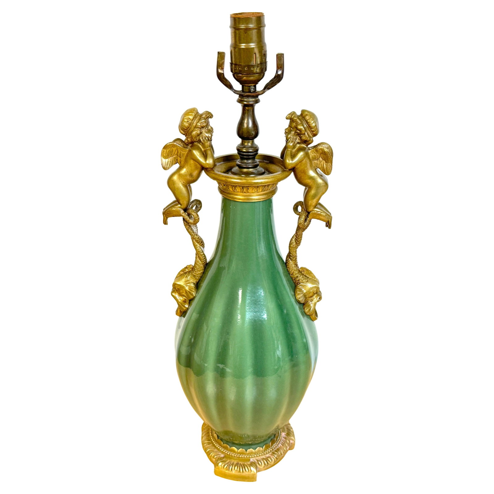 19th Century French Putti Ormolu-Mounted Celadon Vase Lamp: 19th Century French Putti Ormolu-Mounted Celadon Vase Lamp This exquisite 19th-century French lamp is a transformed Chinese celadon-glazed porcelain vase, elegantly mounted with finely cast gilt bronz