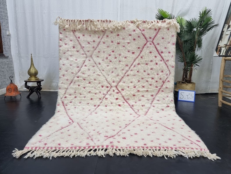 Handmade Moroccan Berber Wool Rug White Pink Geometric Design: Handmade Moroccan Berber Wool Rug White Pink Geometric Design Enhance your living space with this Lovely Soft White Handmade Moroccan Berber Wool Area Rug. Adorned with charming pink dots and a stylis