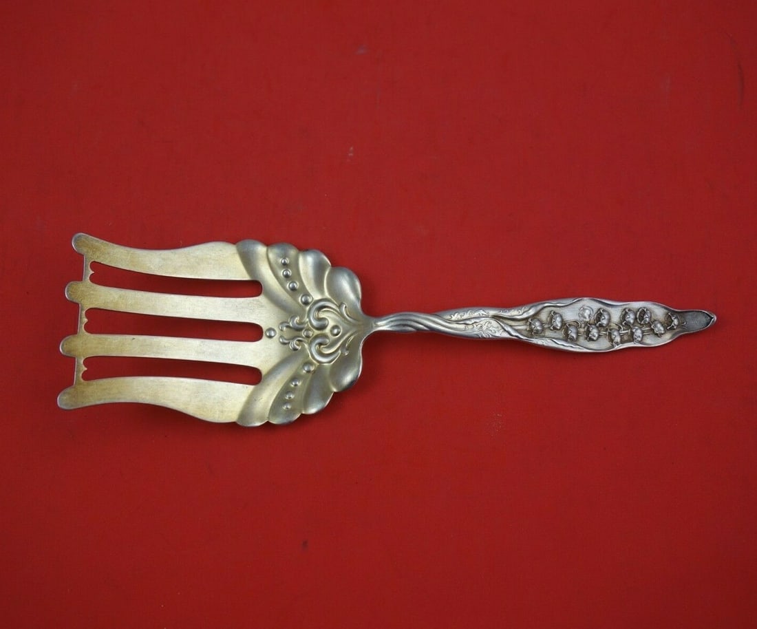 Whiting Sterling Silver Asparagus Fork Lily of the Valley 8.5 Inch: Whiting Sterling Silver Asparagus Fork Lily of the Valley 8.5 Inch This exquisite serving fork, crafted by Whiting, features the elegant Lily of the Valley pattern. Made of sterling silver with a gold