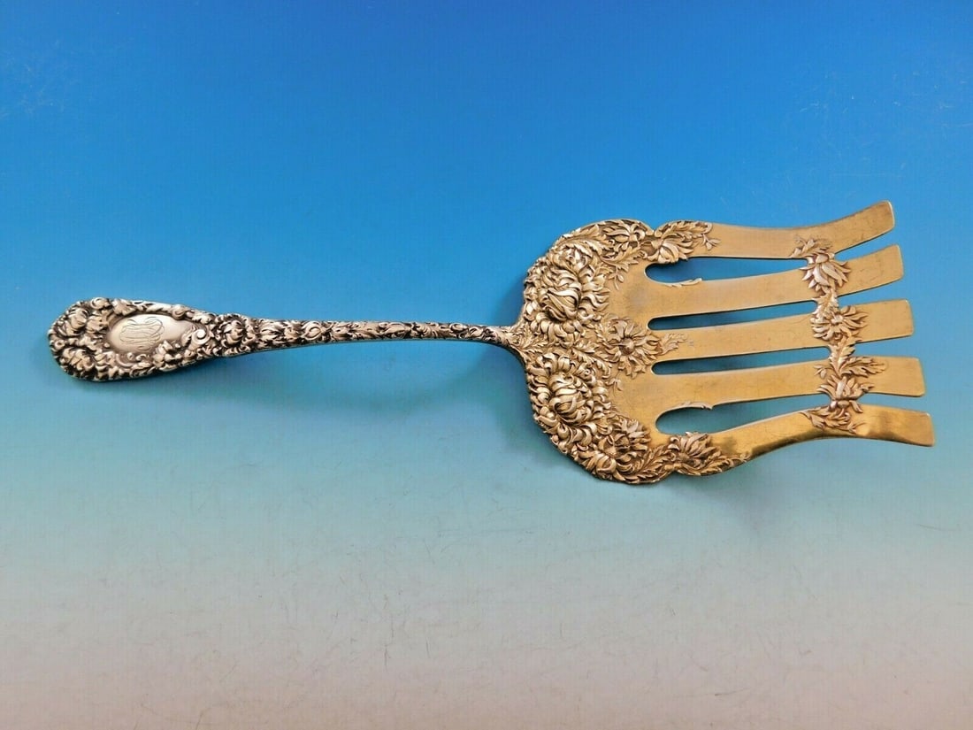 Durgin Chrysanthemum Sterling Silver Asparagus Fork Gold Wash 9.75": Durgin Chrysanthemum Sterling Silver Asparagus Fork Gold Wash 9.75" This exquisite serving fork is a stunning piece from the renowned Durgin brand, crafted in sterling silver and featuring the elegant
