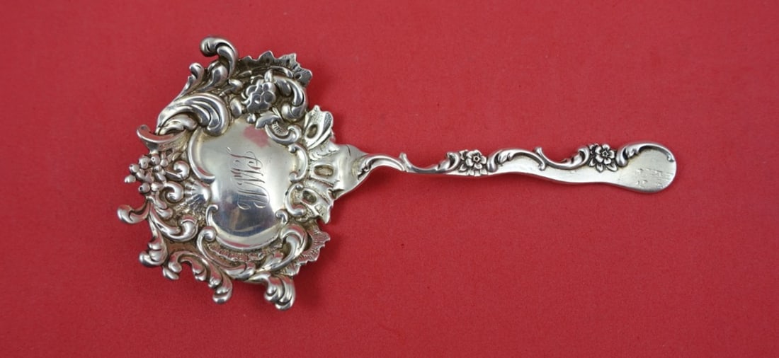 Shiebler Sterling Silver Nut Spoon with Floral Leaf Motif 5 Inch: Shiebler Sterling Silver Nut Spoon with Floral Leaf Motif 5 Inch This Shiebler sterling silver nut spoon features an intricate floral and leaf design around the bowl. Measuring 5 inches in length, thi