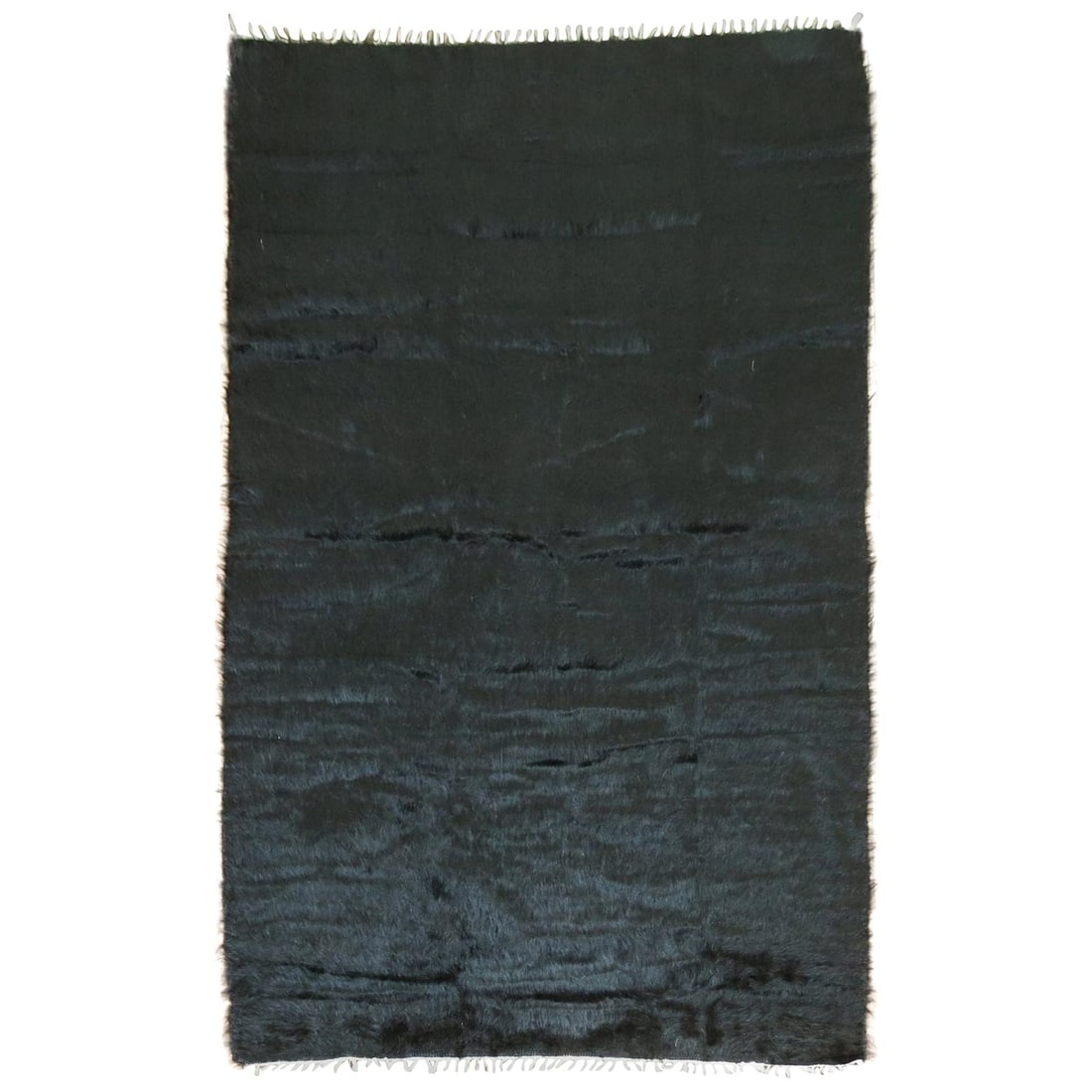 Hand Woven Black Mohair Wool Rug 54 x 75 in: Hand Woven Black Mohair Wool Rug 54 x 75 in This modern rug is crafted from high-quality Angora mohair wool and features a sleek black color. Hand-woven in Turkey, it showcases a contemporary style an