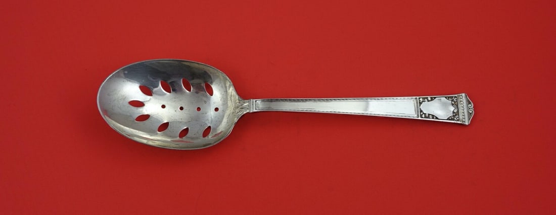 Tiffany & Co San Lorenzo Sterling Silver Pierced Serving Spoon 9 1/4": Tiffany & Co San Lorenzo Sterling Silver Pierced Serving Spoon 9 1/4" Enhance your dining experience with this exquisite San Lorenzo vegetable serving spoon by Tiffany & Co. Crafted in sterling silver
