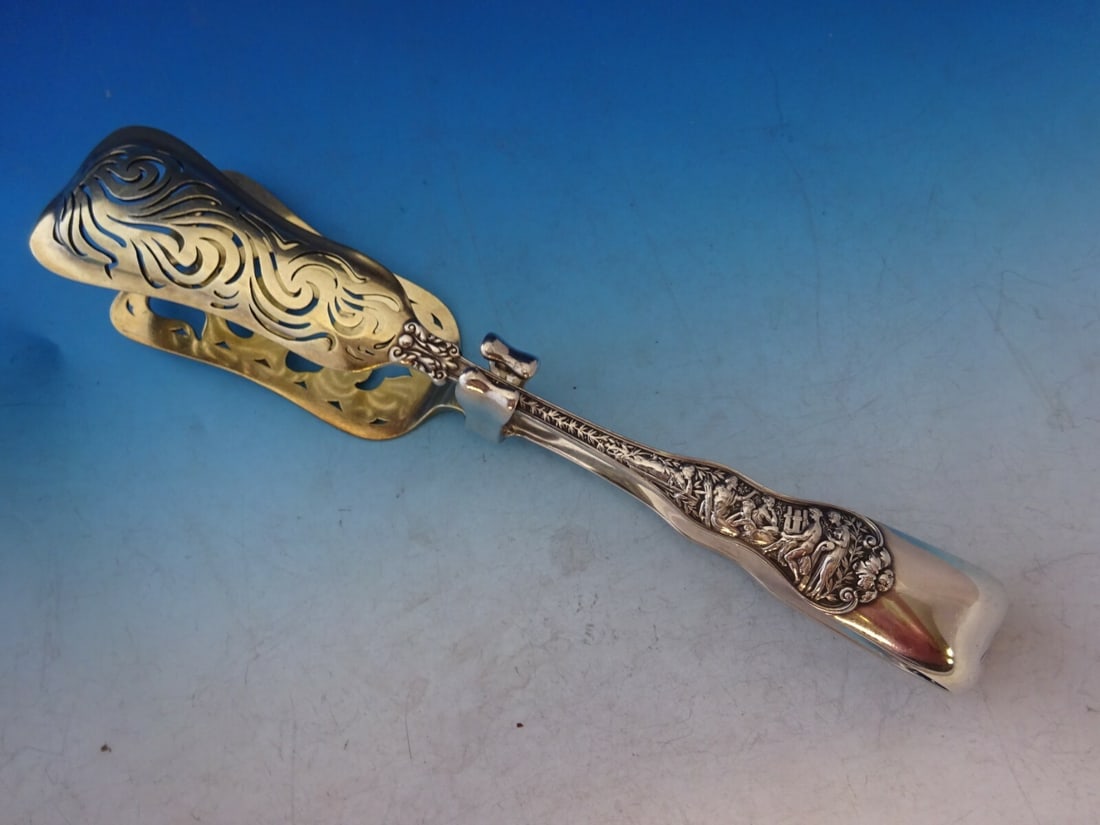 Tiffany & Co Olympian Sterling Silver Yoked Asparagus Tong Gold Washed 9 3/4": Tiffany & Co Olympian Sterling Silver Yoked Asparagus Tong Gold Washed 9 3/4" A rare Olympian by Tiffany & Co. asparagus serving tong in sterling silver with gold wash, English style yoked design, and