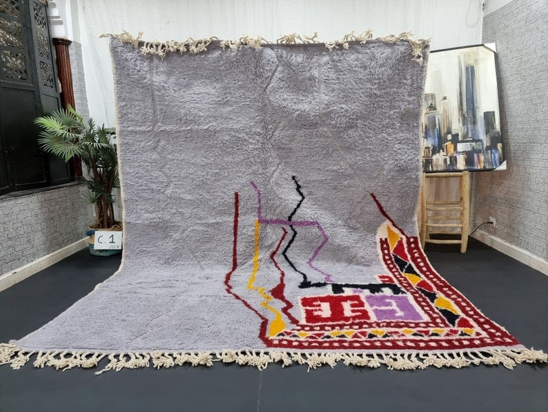 Authentic Handmade Moroccan Berber Wool Area Rug 9.84 x 6.56 feet: Authentic Handmade Moroccan Berber Wool Area Rug 9.84 x 6.56 feet Enhance your space with this stunning authentic handmade Moroccan Berber wool area rug. Handwoven by local Berber women in the Atlas M