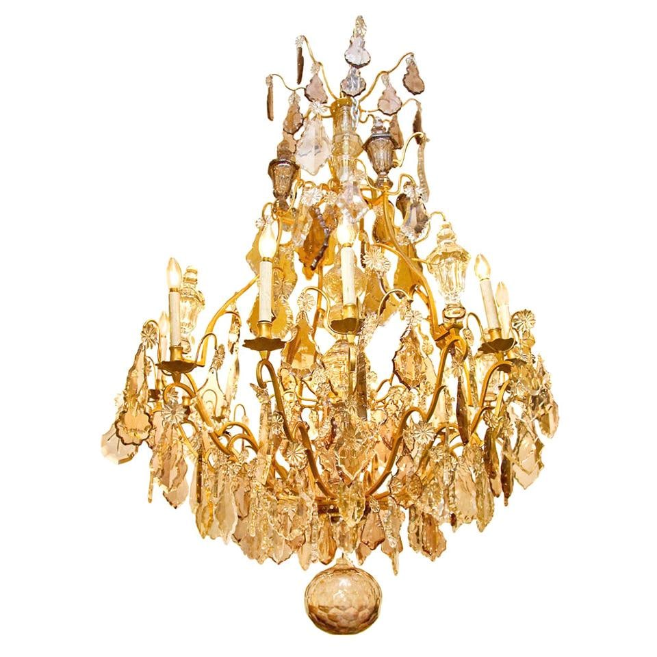 70 in French Louis XVI Style 12 Light Gilt Bronze Crystal Chandelier: 70 in French Louis XVI Style 12 Light Gilt Bronze Crystal Chandelier A monumental French Louis XVI style cage-form chandelier with gilt bronze and crystal construction. It features 12 lights, amethyst
